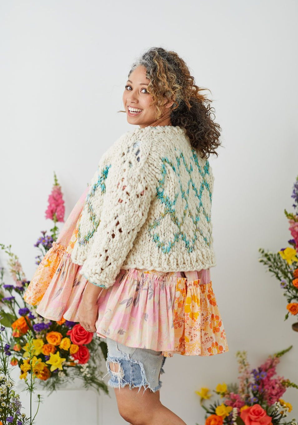 Knit cardigan with lace on sleeves