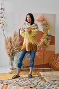 Model grabs the Soulshine Cardi with both hands