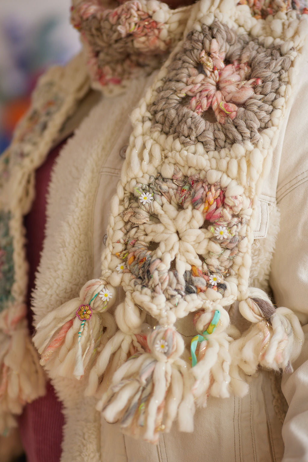 Crochet scarf detail featureing granny square hexagon with Daisy Chain yarn details and tassels