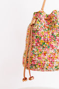 Close-up of bag's drawstrings with top of bag cinched shut