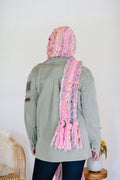 The Gotta Be Hoodie Scarf has long ends that can be wrapped around the neck for warmth