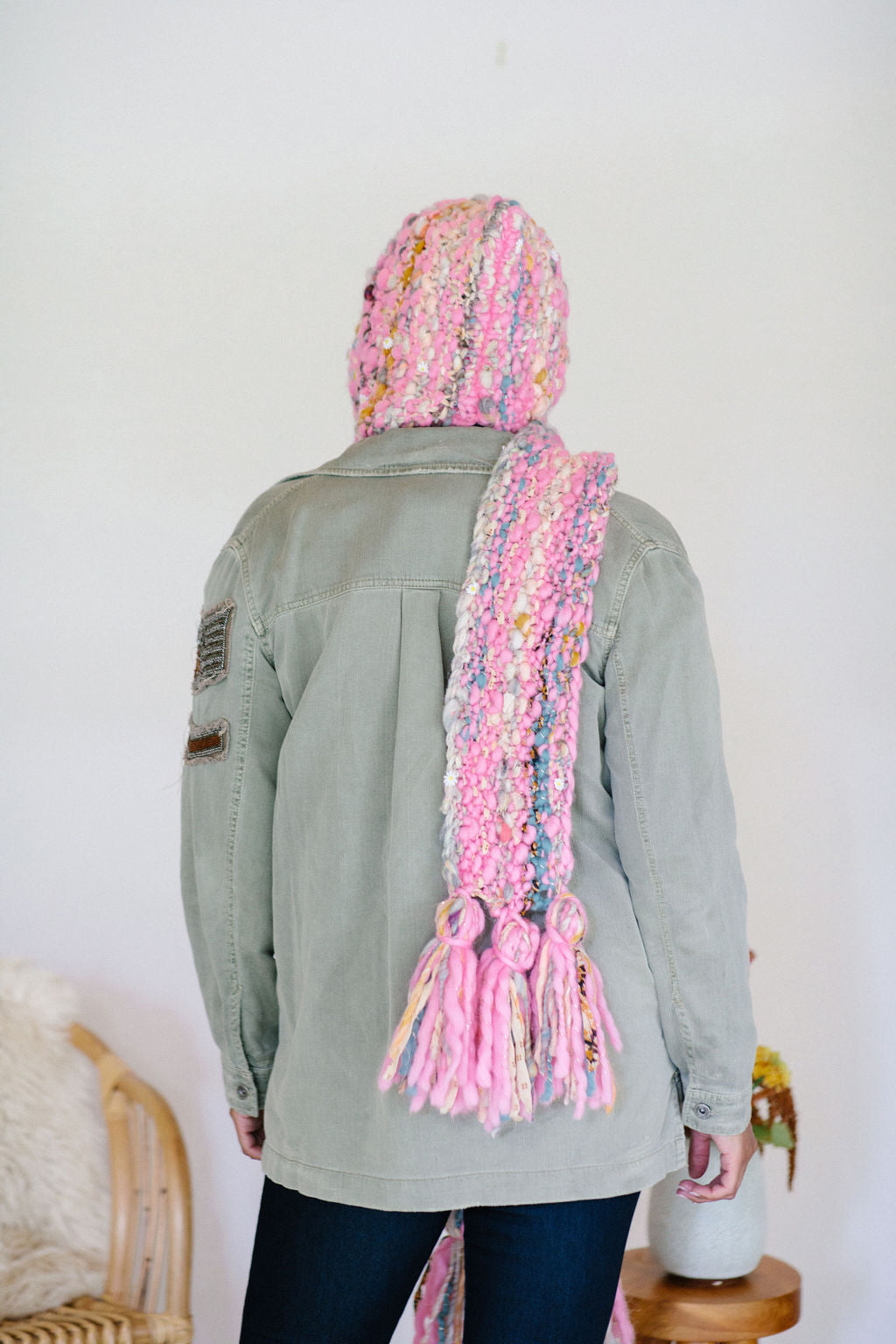 The Gotta Be Hoodie Scarf has long ends that can be wrapped around the neck for warmth