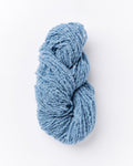 A brushed boucle yarn in a dusty denim blue color