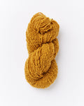 A brushed boucle yarn in a marigold ochre mustard yellow color
