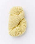 A brushed boucle yarn in a butter yellow color.