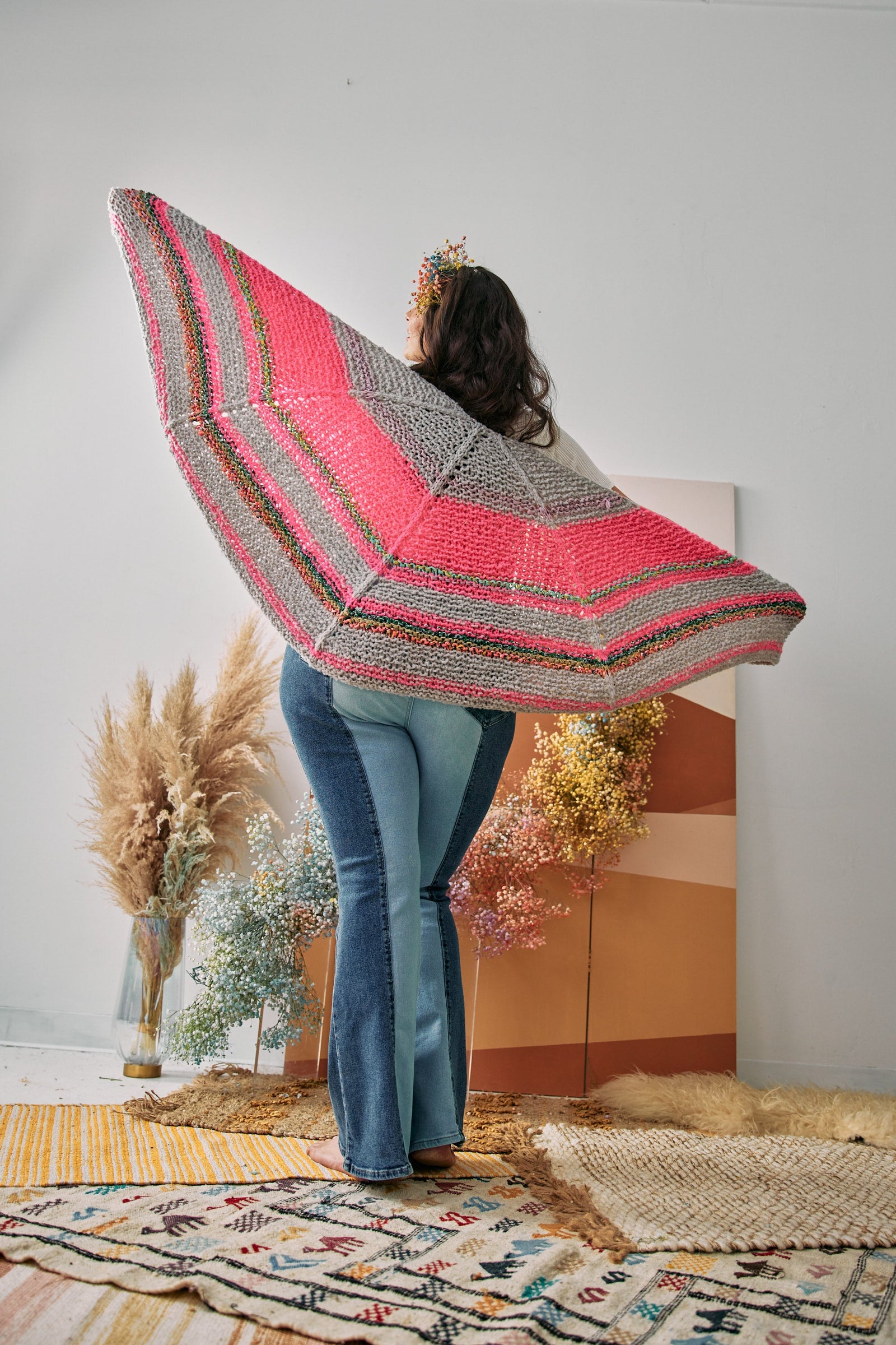 Model shows the back view of the shawl