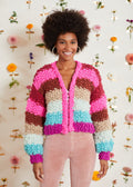 Woman wearing bright colored handknit cardigan