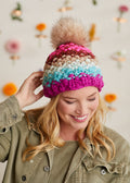 Picture of a model wearing the handknit wool hat.