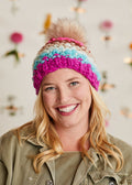 Model with a bright smile shows the front view of the Over The Rainbow Hat.