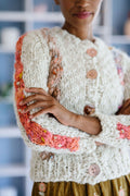 Closeup sleeve detail of the Winding Road cable cardigan