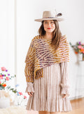 Brioche knit wrap displays subtle stripes within pattern repeats