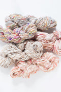 Knit Collage Cast Away yarn. A super bulky, thick-and-thin, handspun wool yarn in a hand carded melange of colors