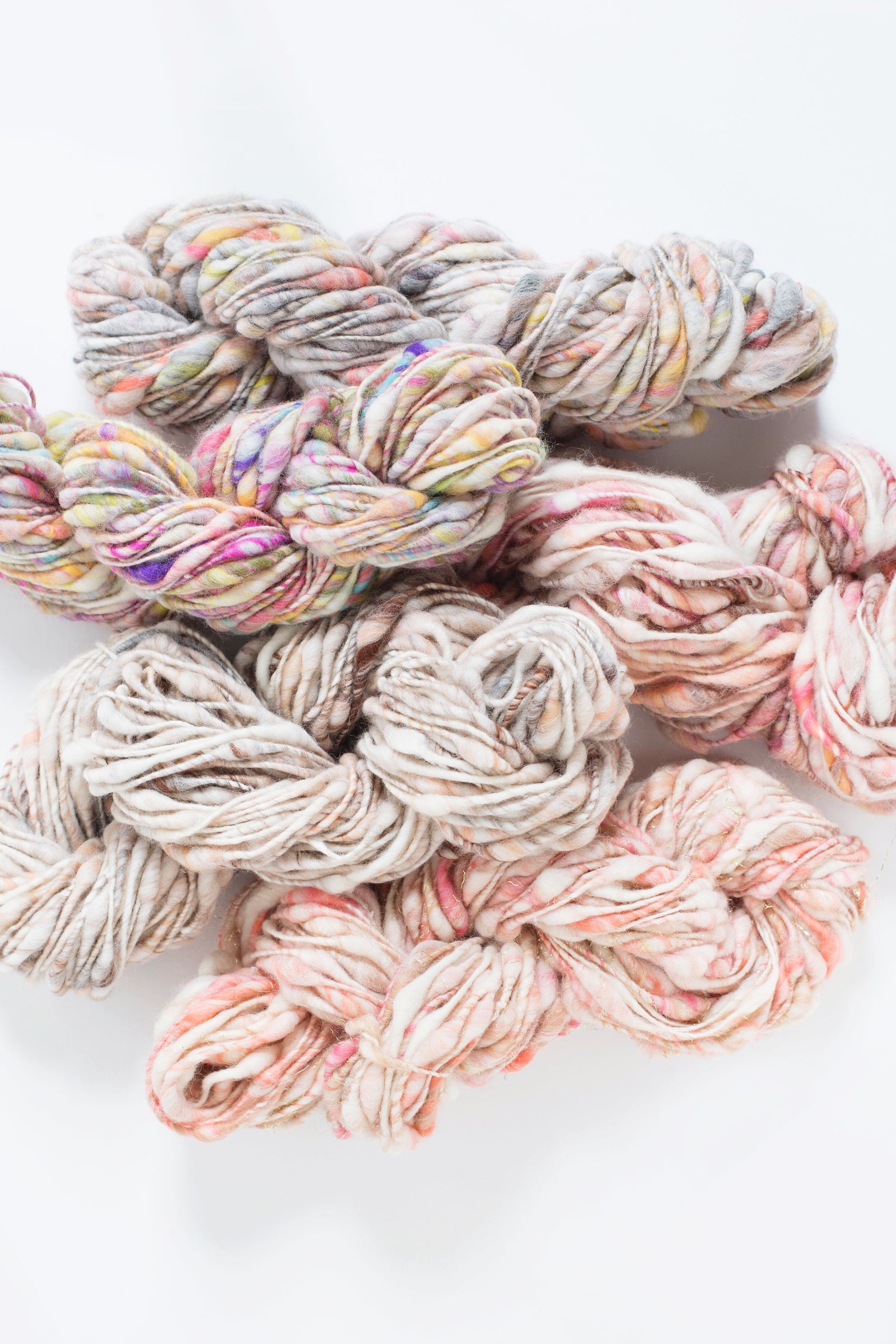 Knit Collage Cast Away yarn. A super bulky, thick-and-thin, handspun wool yarn in a hand carded melange of colors