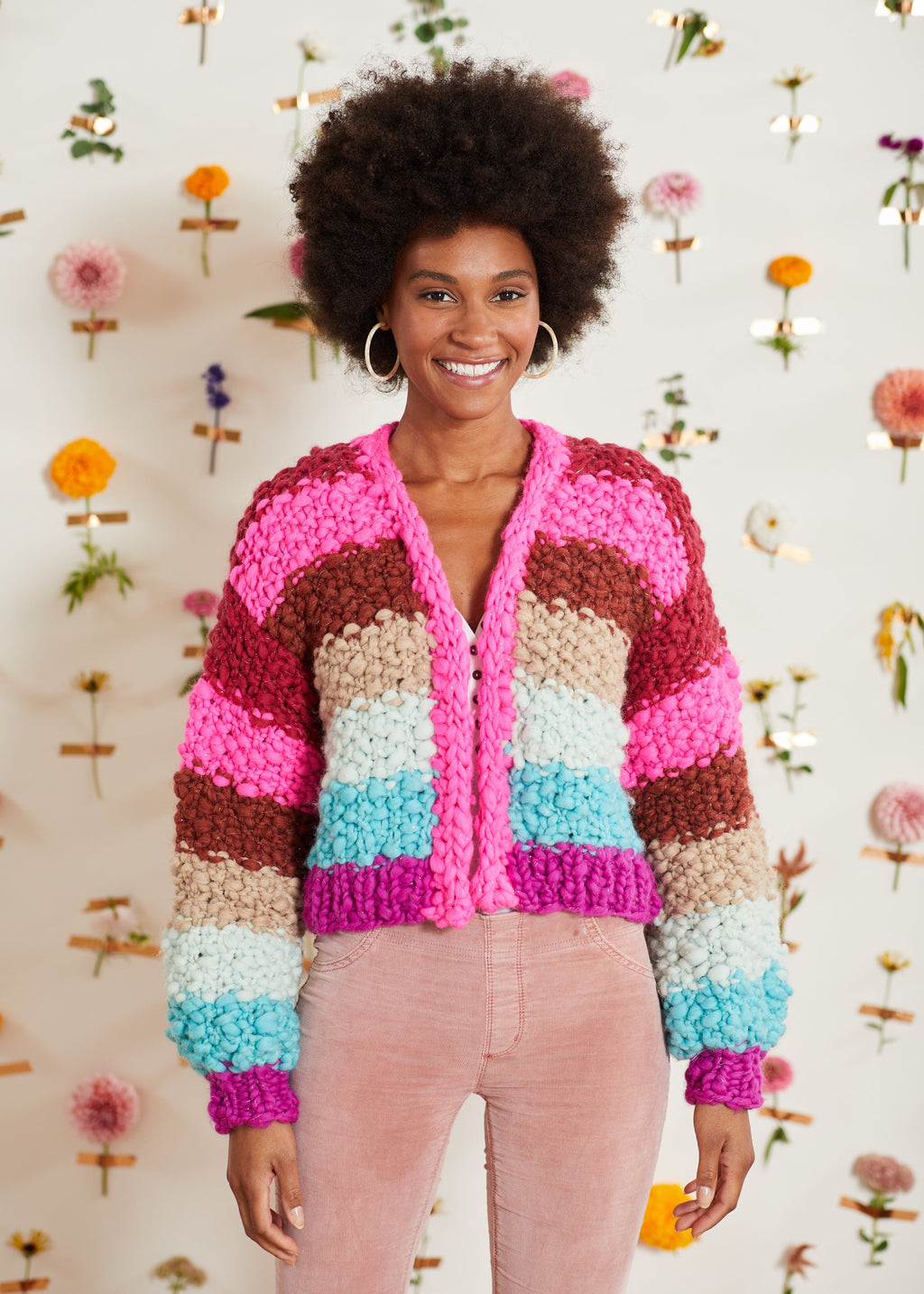 Woman wearing bright colored handknit cardigan