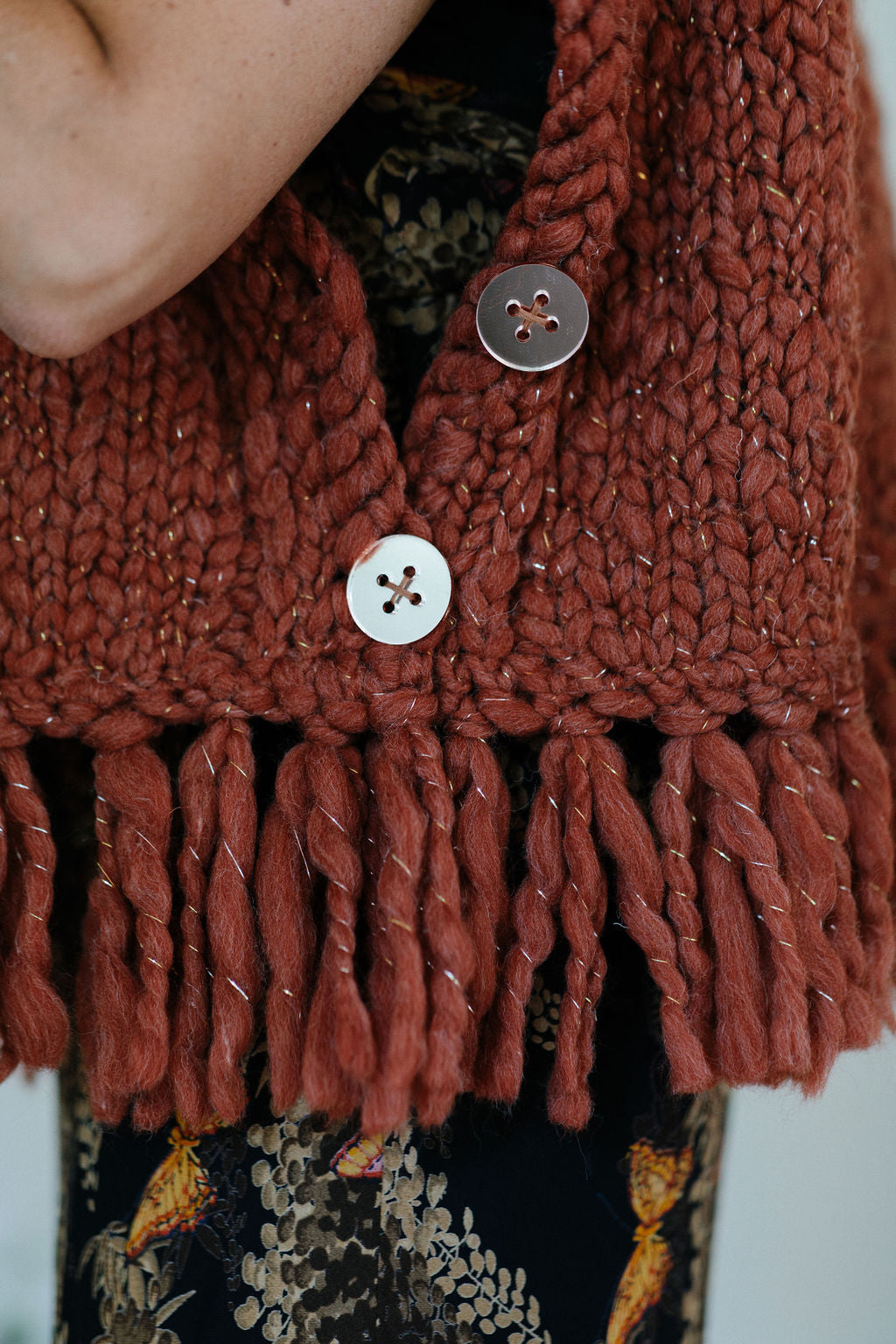 Provence Poncho sample is finished with Rose Gold Mirror buttons and fringe