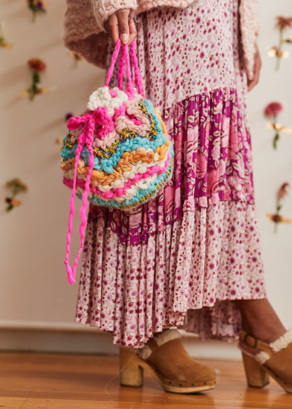 The handknit wool Sunshine sack is small enough to carry around everywhere