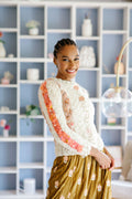 Model in handknit sweater smiles brightly