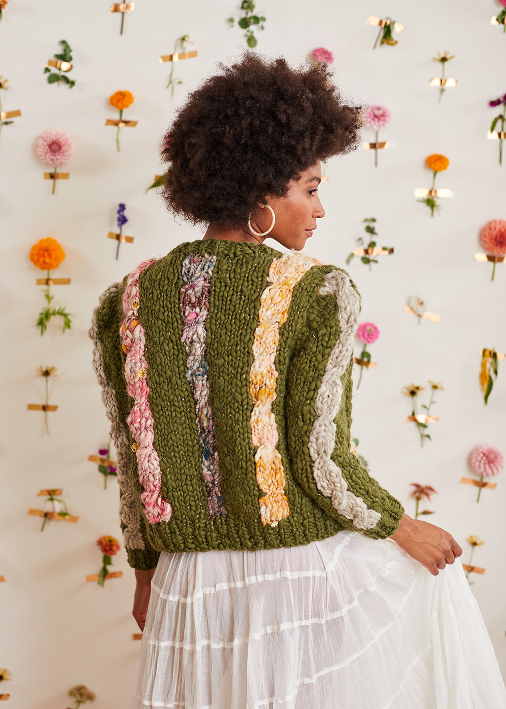 The cables of the Winding Road Cardi are the main attraction with three down the back, one on each sleeve and two down the front